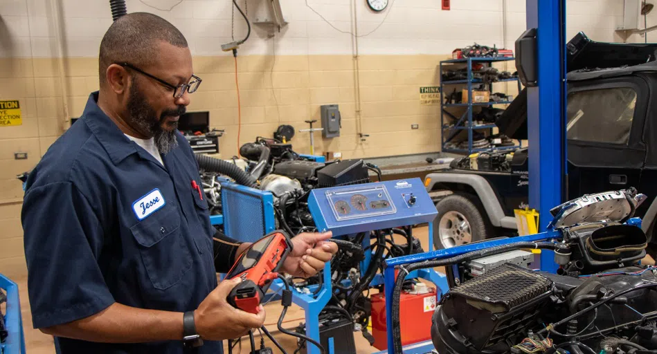 Automotive student Jesse Best runs diagnostic testing.