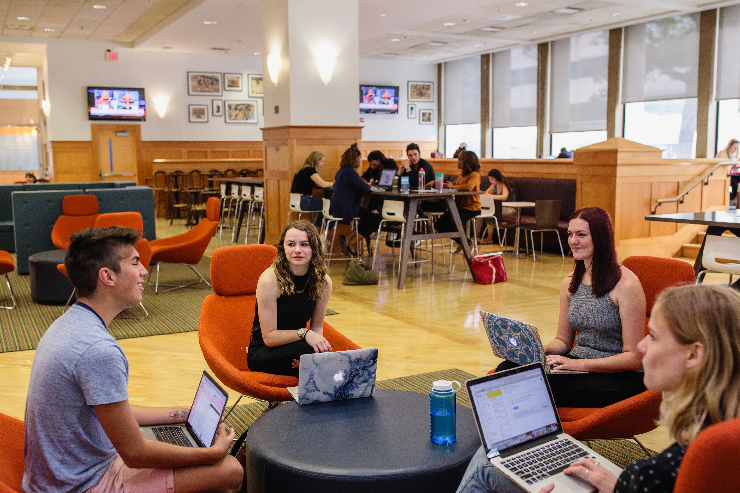 Students working together in the University Student Center study space.