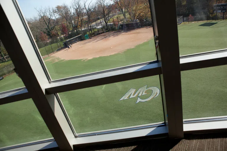 View from an Ames Hall skybox window overlooking the baseball field with GW painted on the grass. 