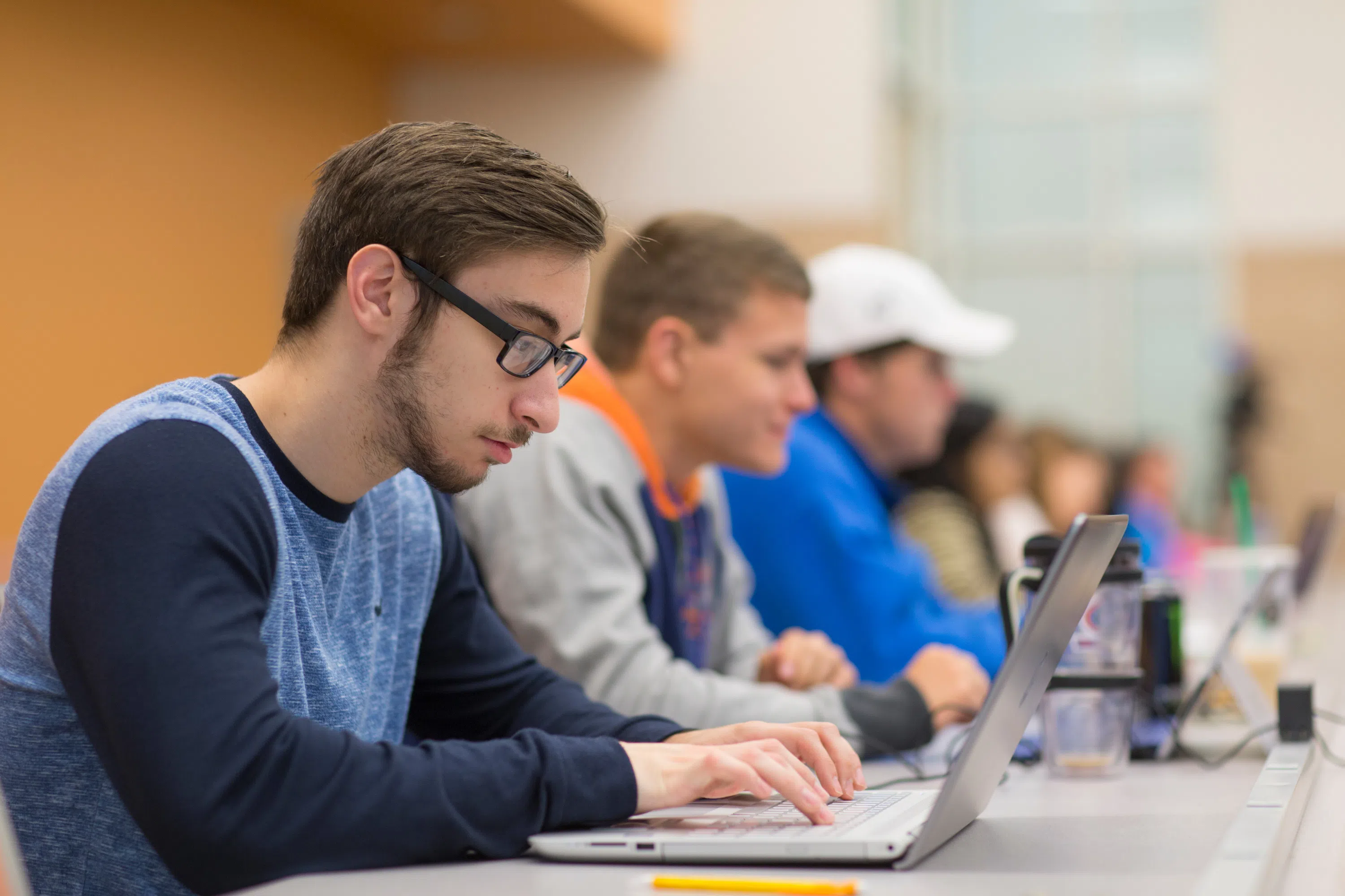 Students take notes in a second floor classroom