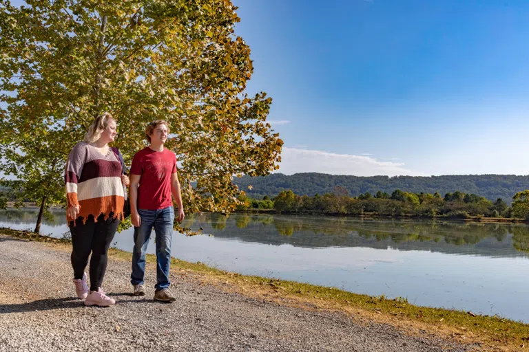 Two students walk along Paris Lake on GHC's Floyd Campus