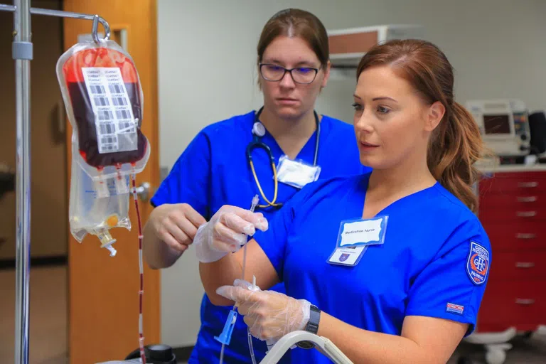 Students prepare blood transfusion in Nursing Simulation Lab