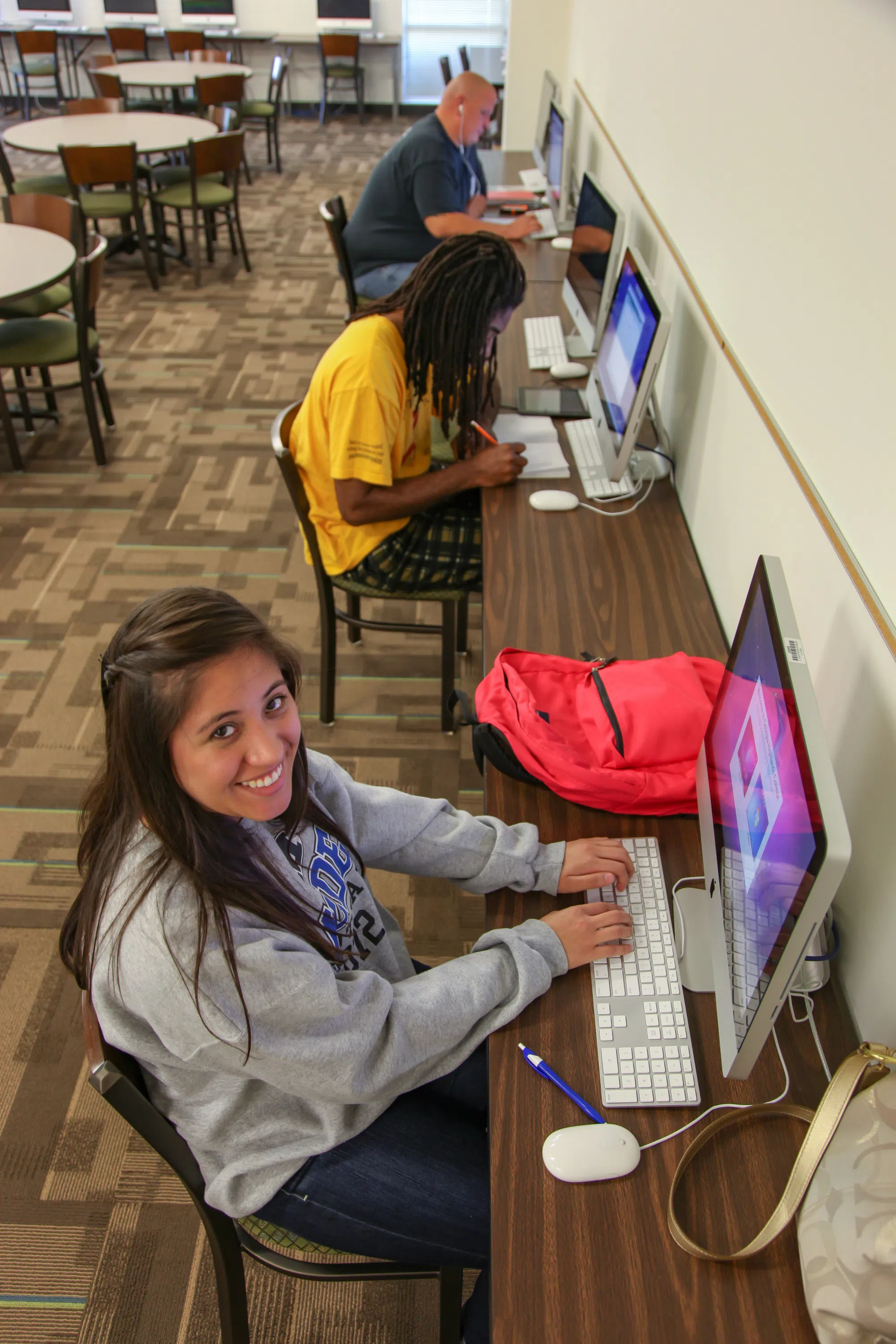 Students study at the computers in the library classroom