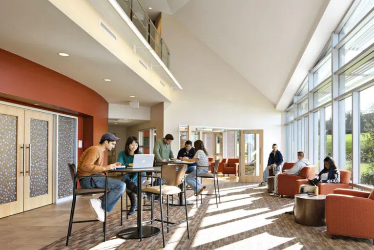 Students sitting at tables in a room