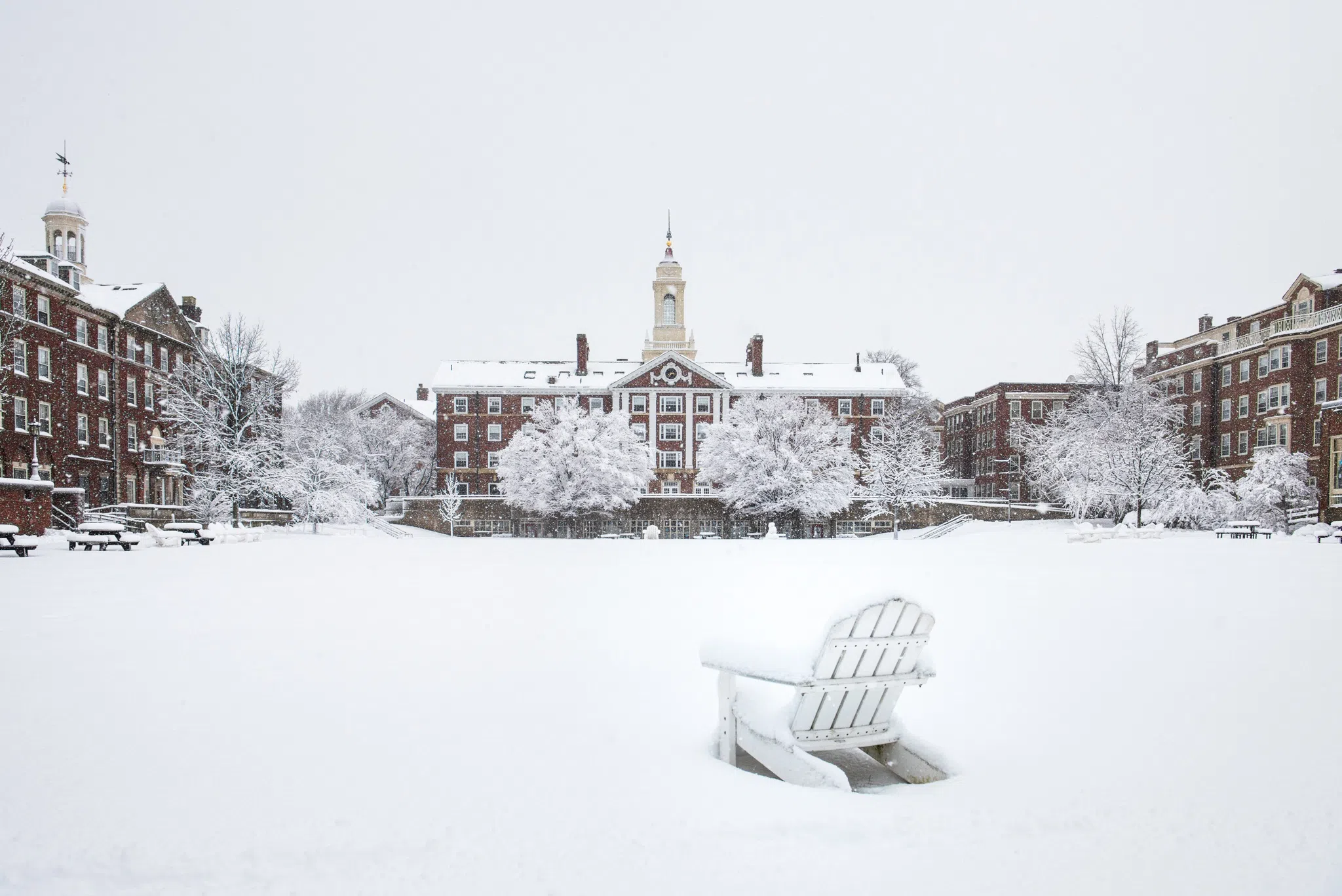 Dormitory building and adjacent quad blanketed in snow