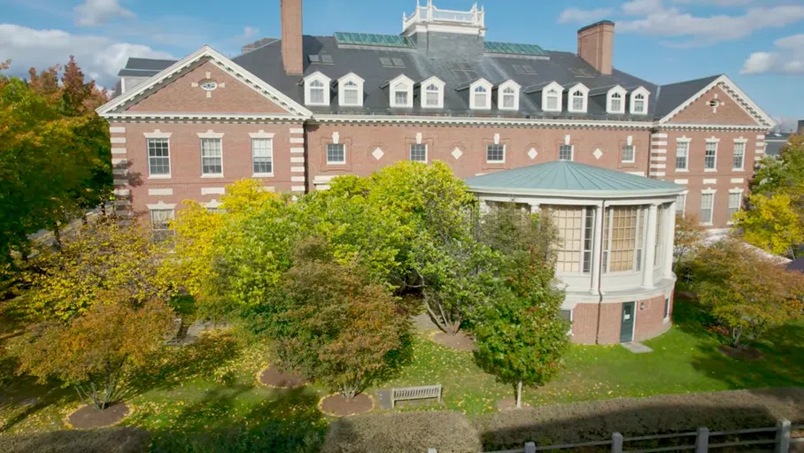 Red brick building surrounded by trees