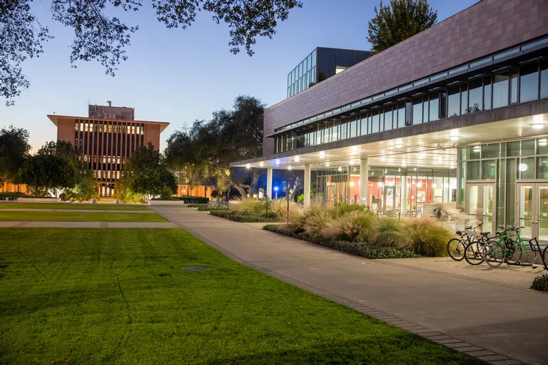 Campus with two buildings at night