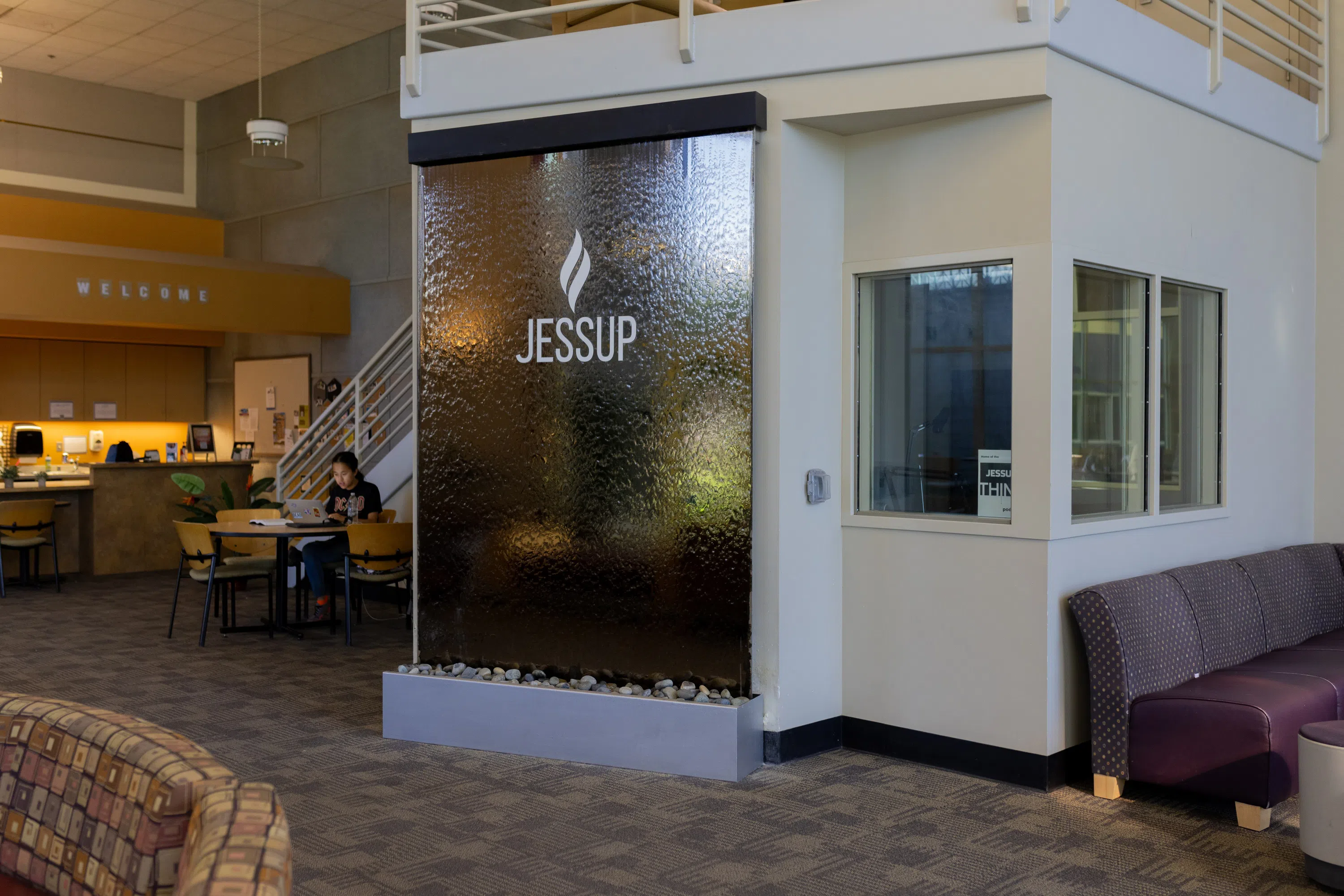 Lobby of Crawford Commons with water-feature signage with "Jessup" logo