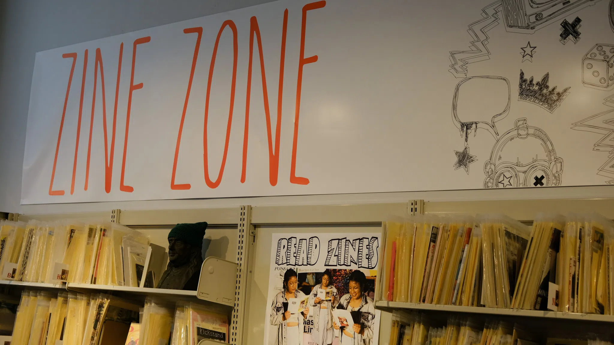 A wall of organized "zines," including many from local artists and writers.