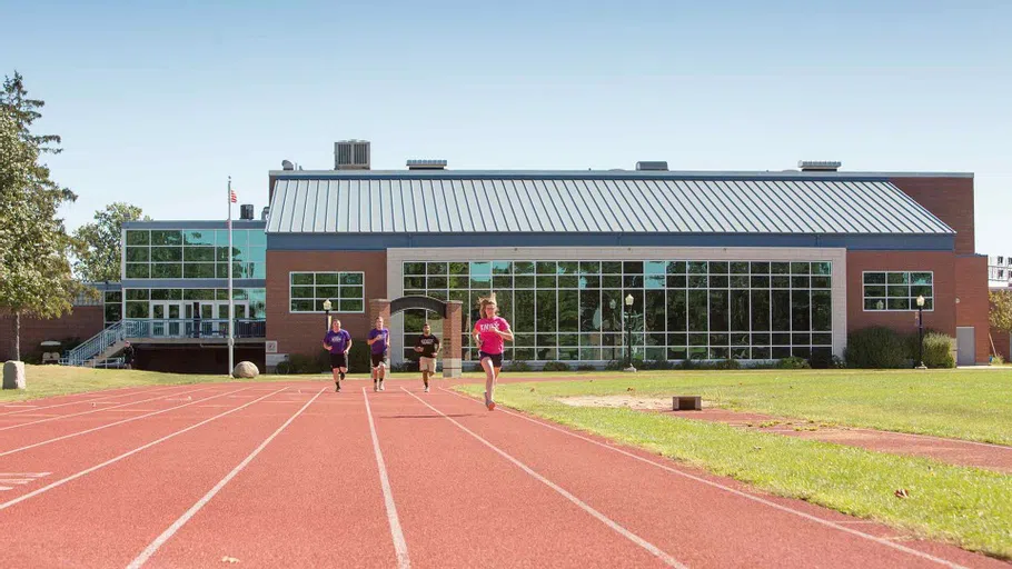 Students run around the track outside the E. & L. Andrew Fitness Center at Knox College