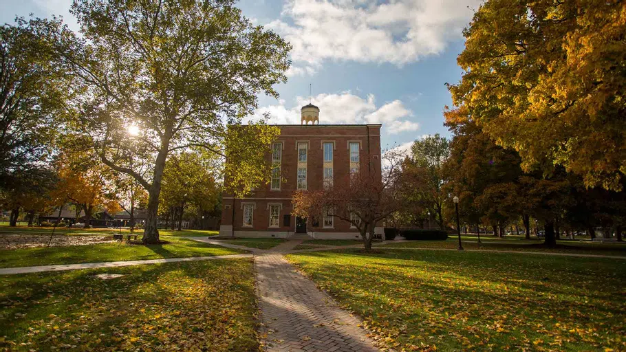 Brick sidewalks lead the way to Old Main, the oldest building on the Knox College campus.