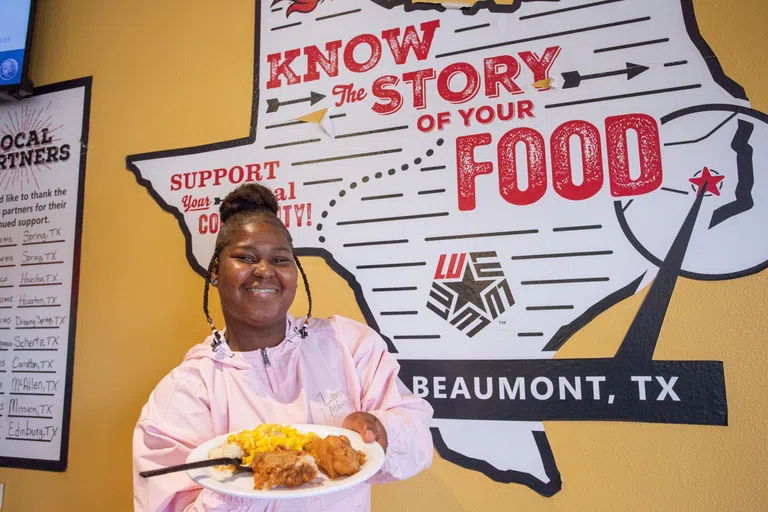 Student with food from Dining Hall 