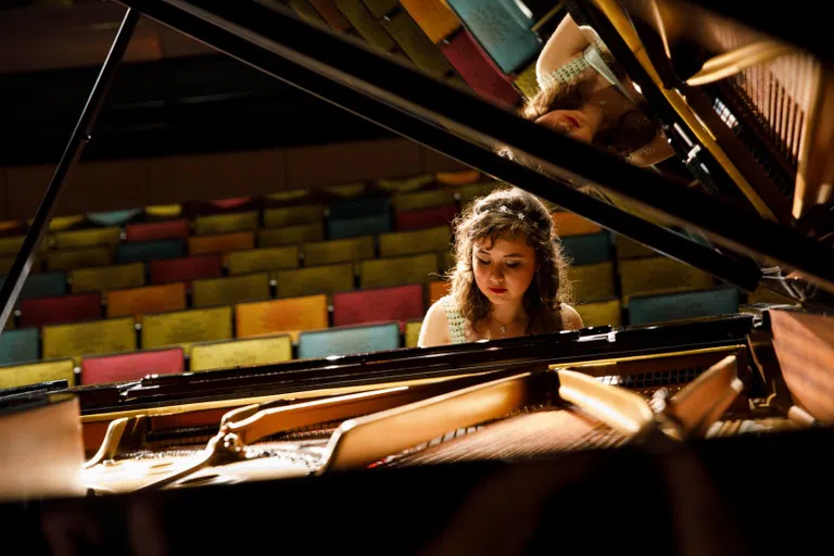 Student Practicing Piano 