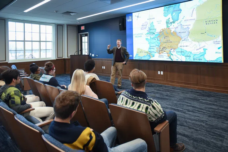 A lecture in the Trogner Presentation Room 