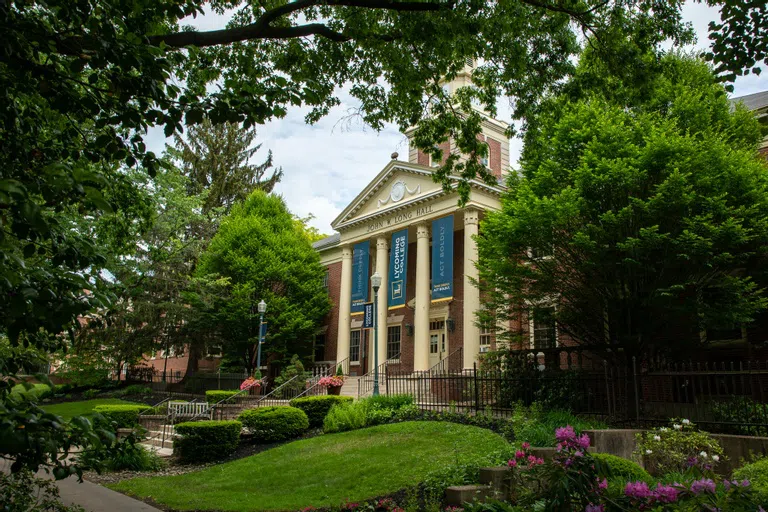 John W. Long Hall on a blooming spring day.