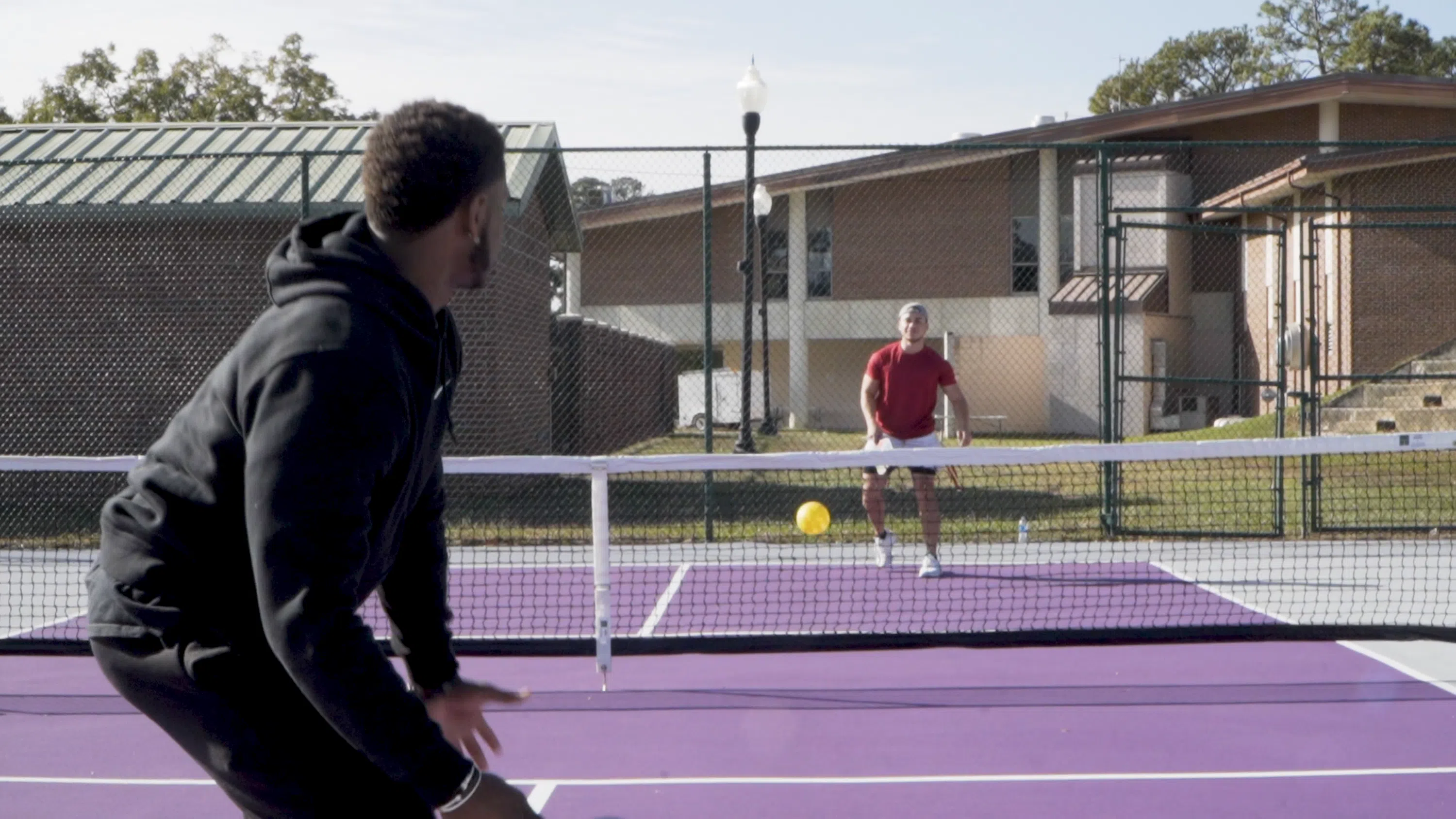 MGA students play tennis.