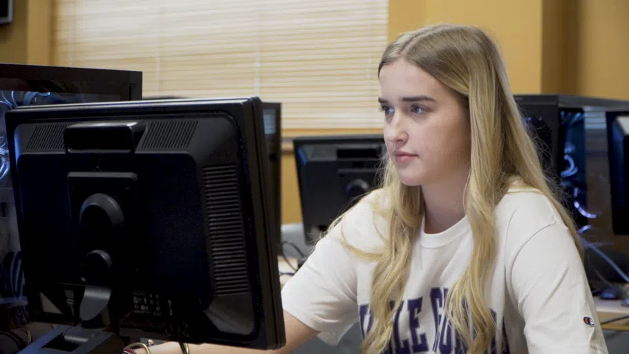 Student works at a computer.