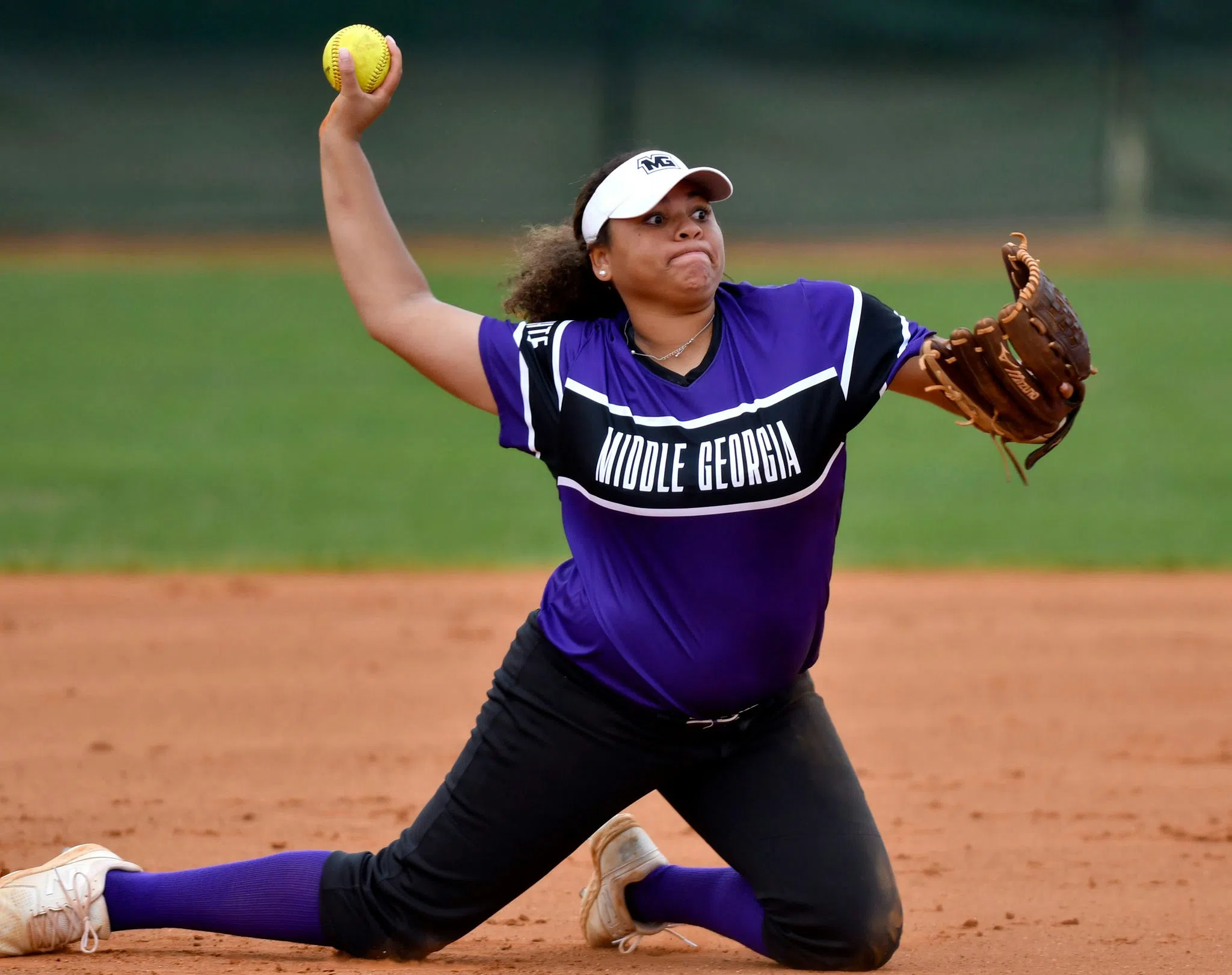 Softball infielder preparing to throw the ball