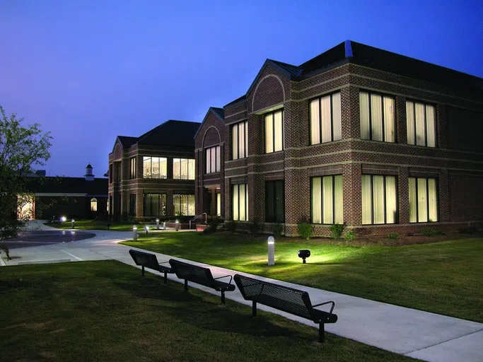 The Academic Services Building at night.