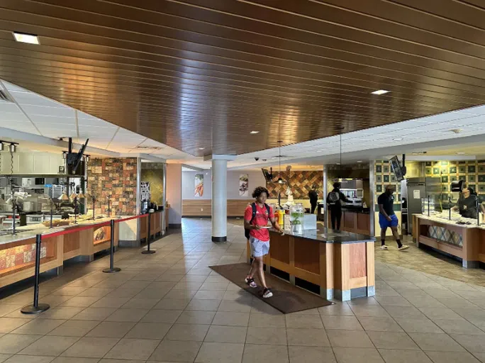 Student walks through the dining hall.