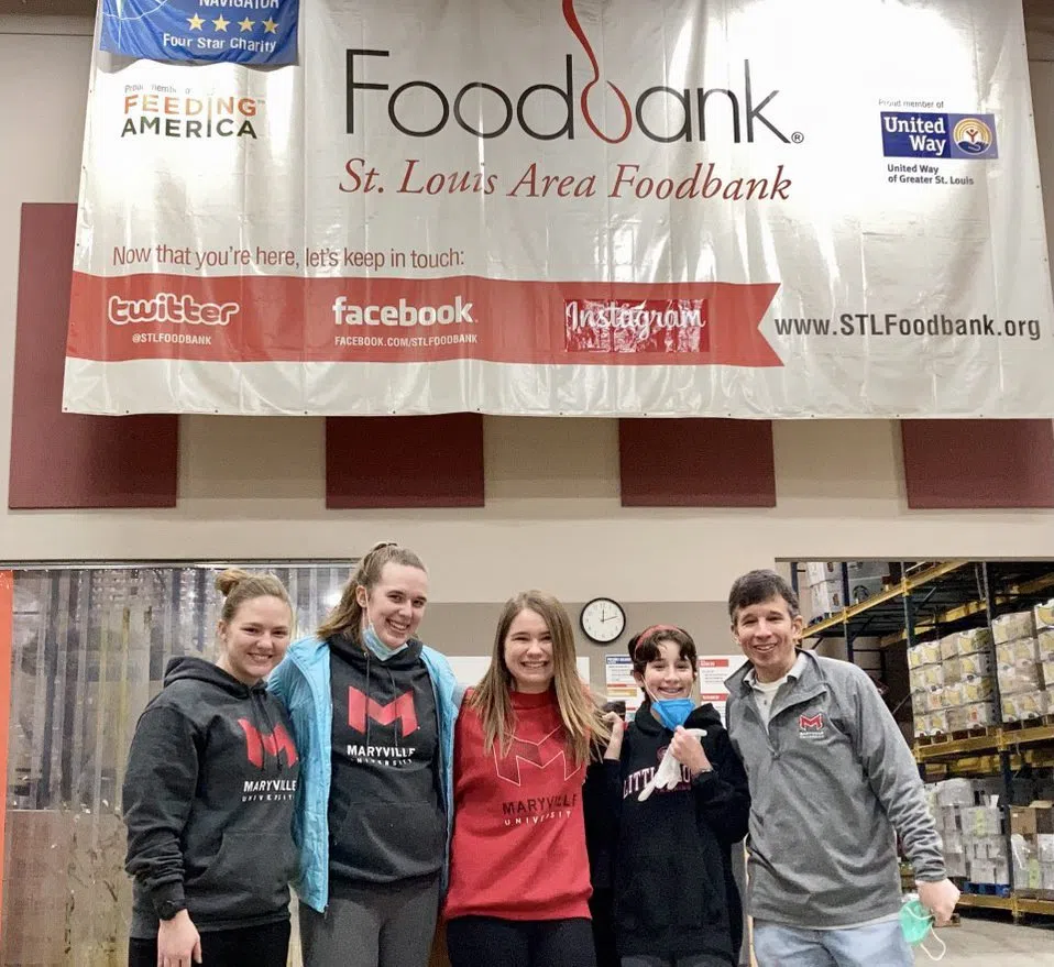 Students and staff volunteer at the St. Louis Area Foodbank.