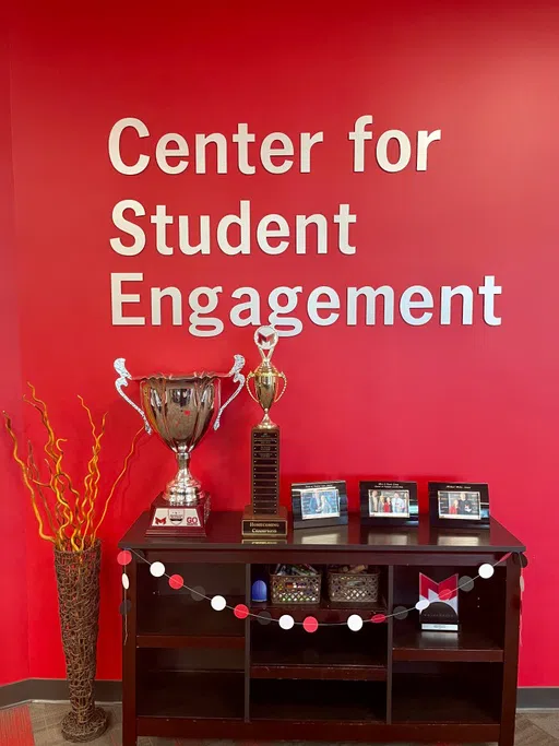 The Goose Cup and Homecoming Champion trophies sit within the CSE.