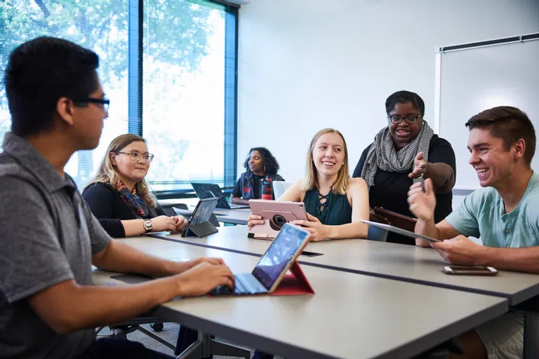 Students in class in Walker Hall. All of the classrooms have mobile furniture they can re-arrange as needed. 