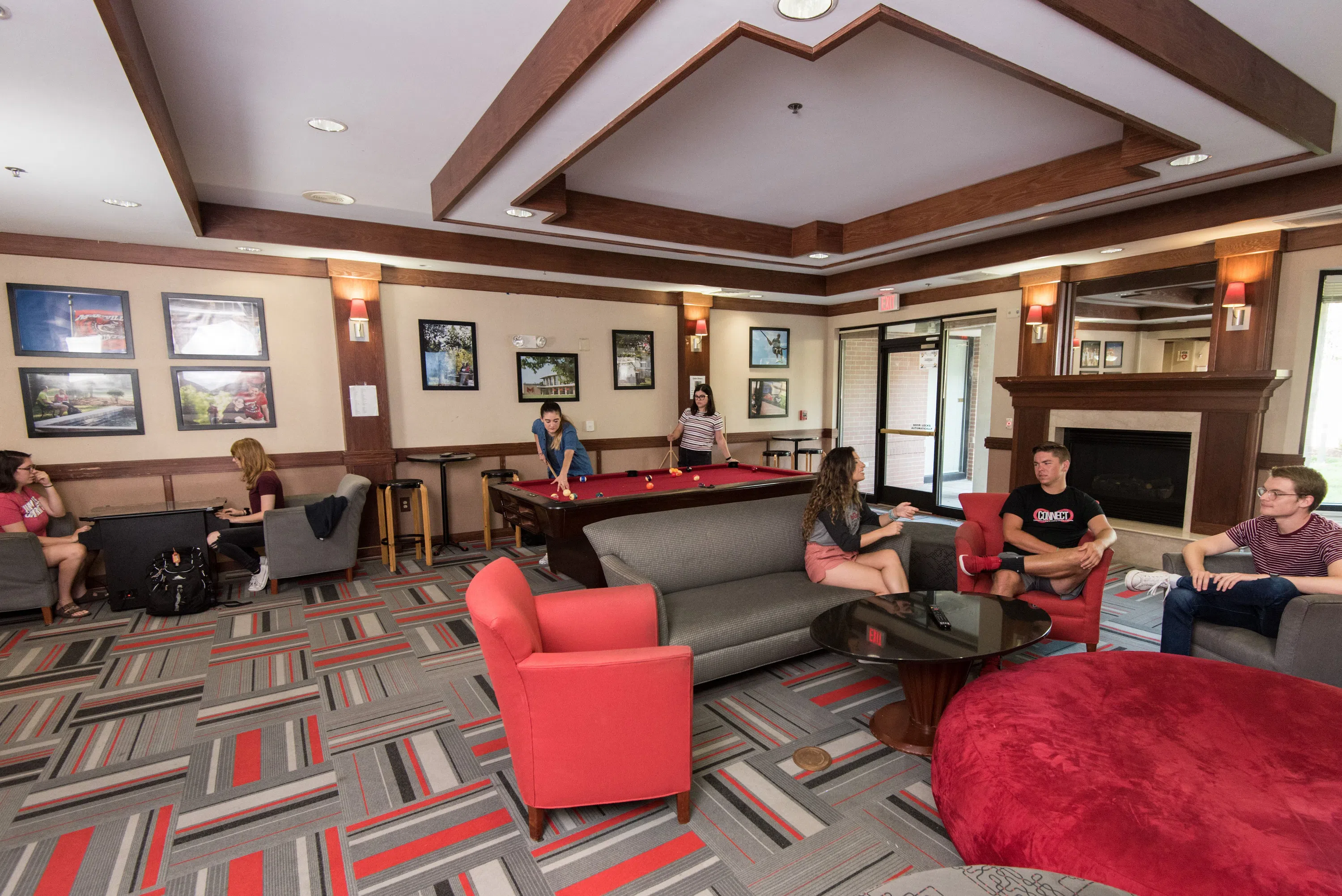 Students hang out in the main lobby of Potter Hall.