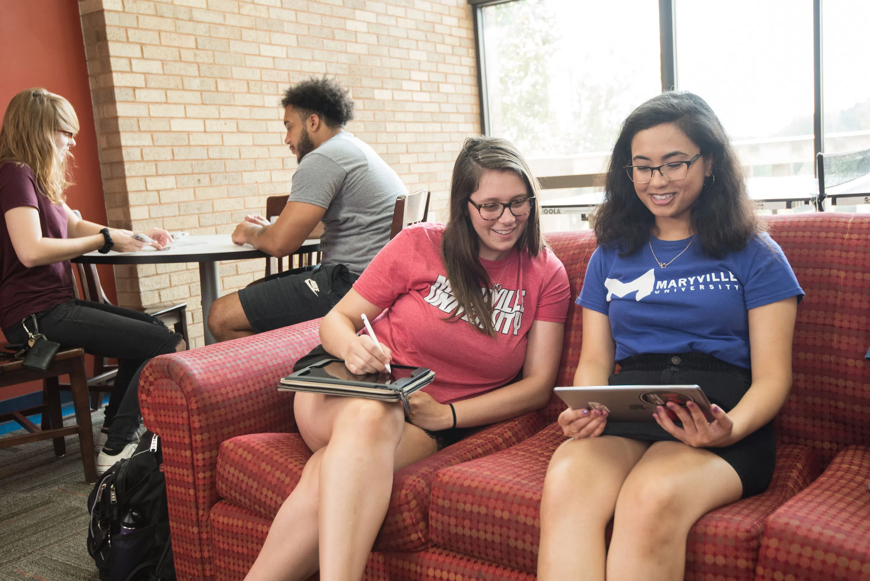 Students relax in one of the lounges in Mouton Hall. 