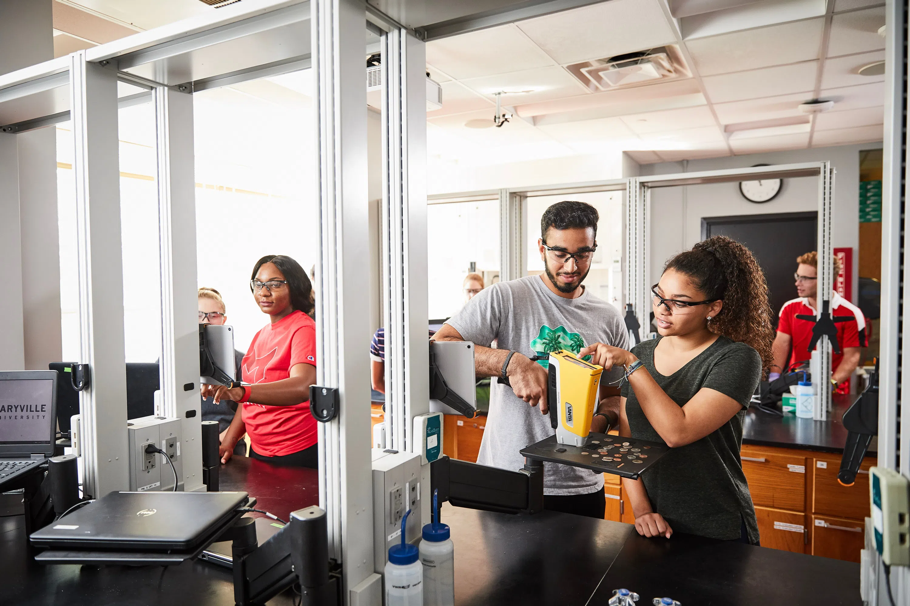 Students work on a project in one of the lab spaces. Students have the opportunity to experience using many tools and a wide array of technology within our science programs. 
