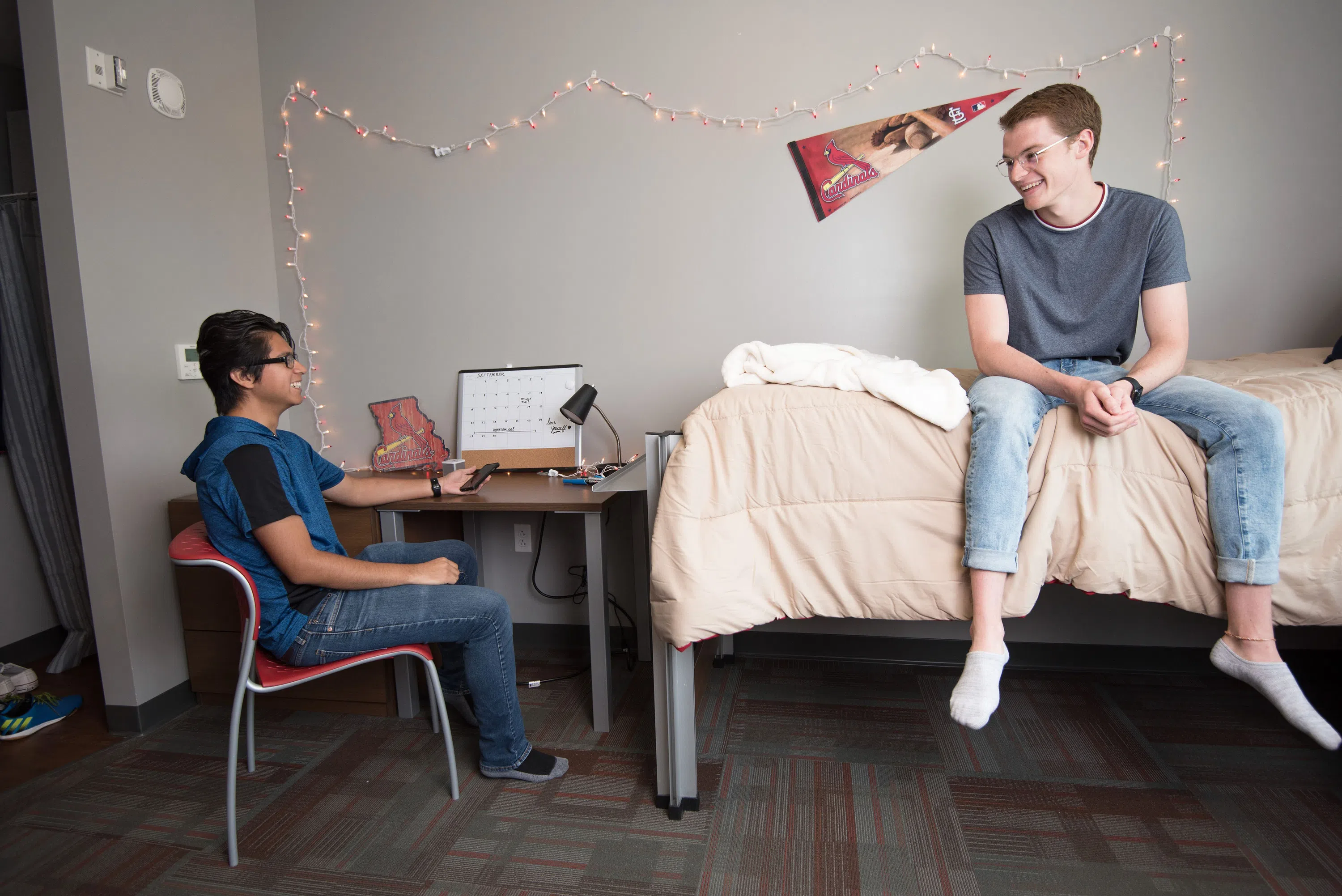 Students relax in the living spaces in Saints Hall.
