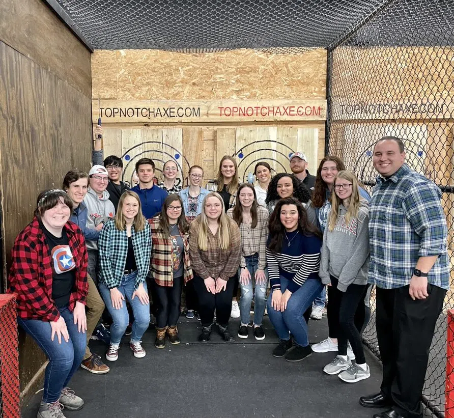 Students from our Newman Center celebrate with some Axe Throwing off campus.