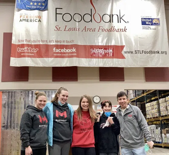 Students and staff volunteer at the St. Louis Area Foodbank.