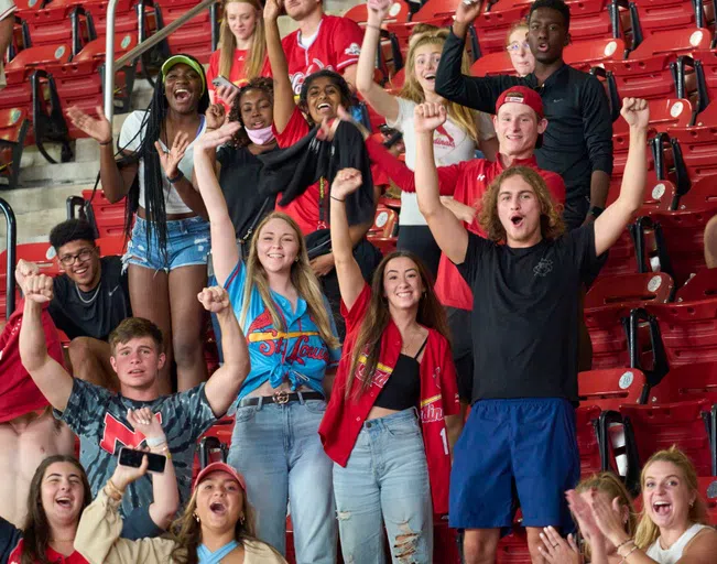 Students cheer on the Cardinals at a home game at Busch Stadium