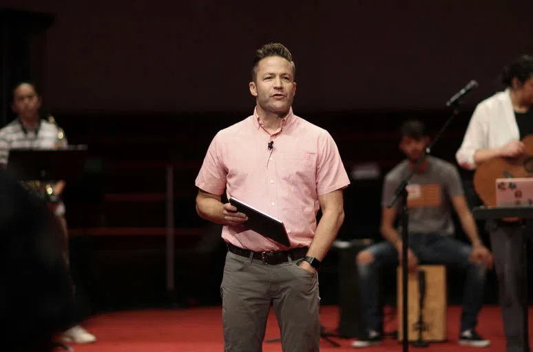 Chaplain Brady Braatz preaching during chapel.