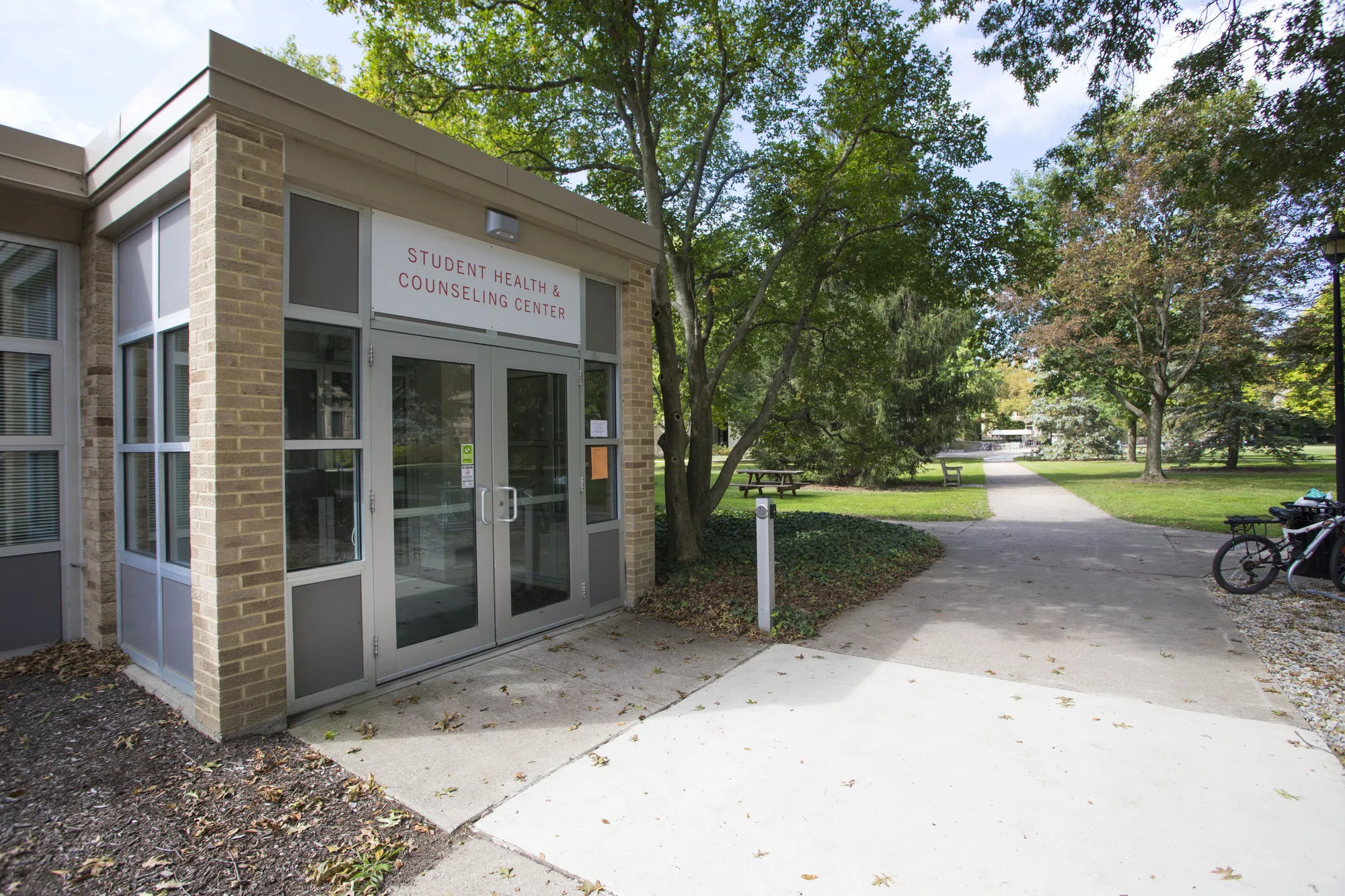A gray brick building with the sign 'Student Health and Counseling Center' is where students can find mental and physical health support.