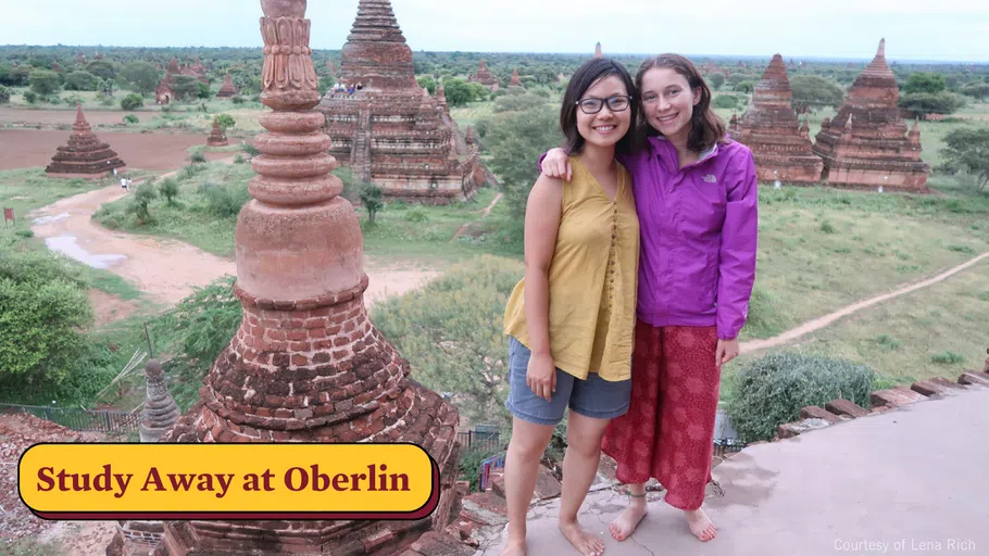 Two students stand for a photo in Myanmar.