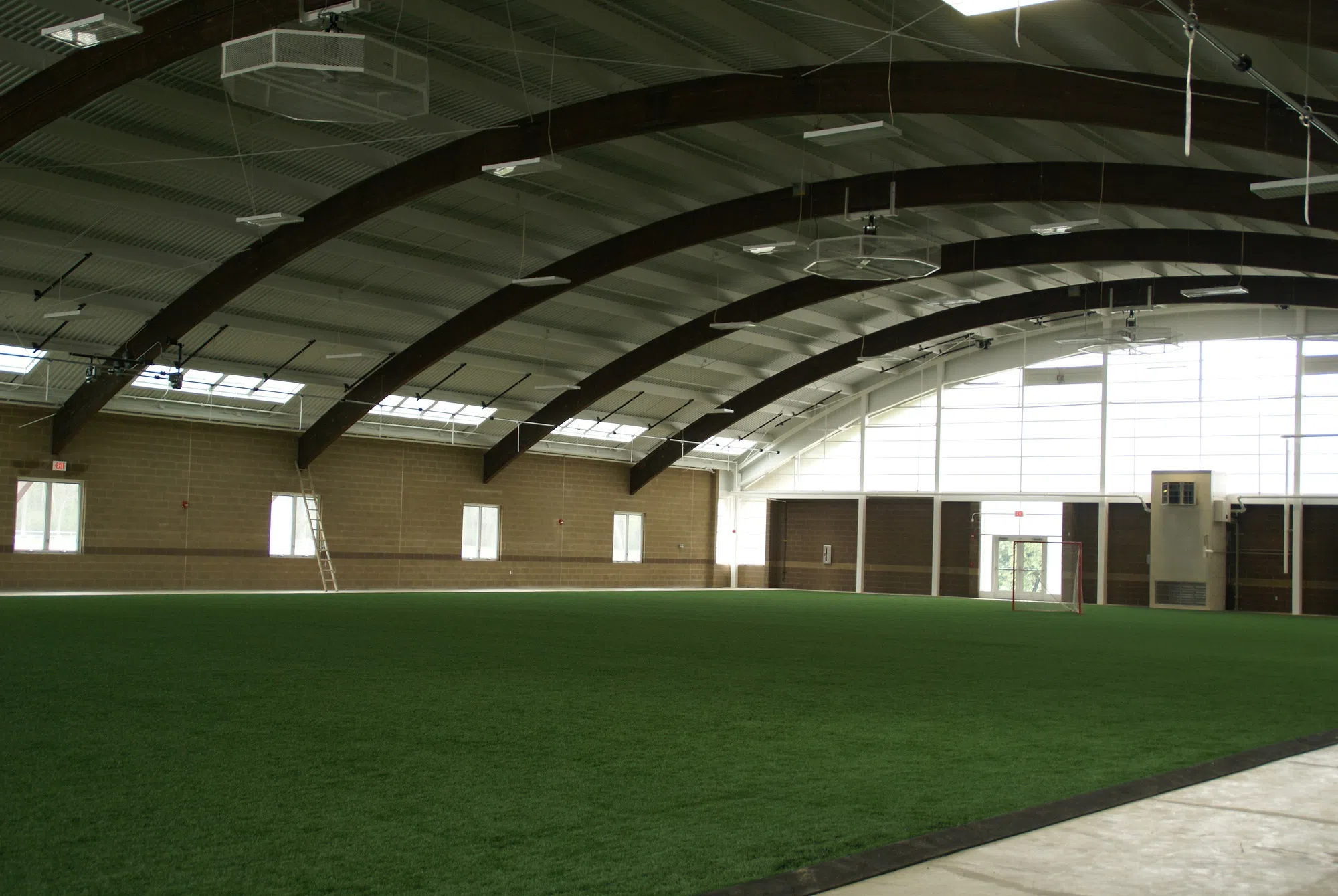 An indoor turf field is shown in this picture. 