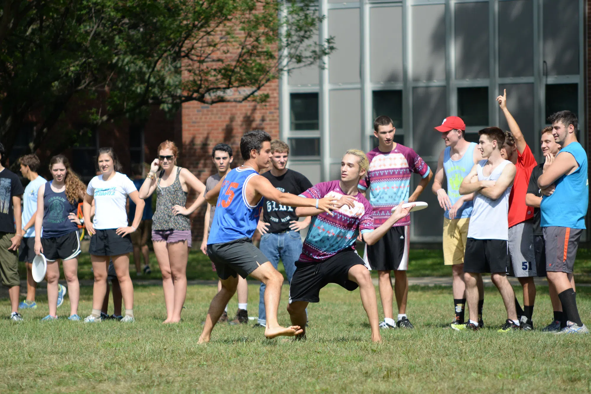 A group of students play frisbee.