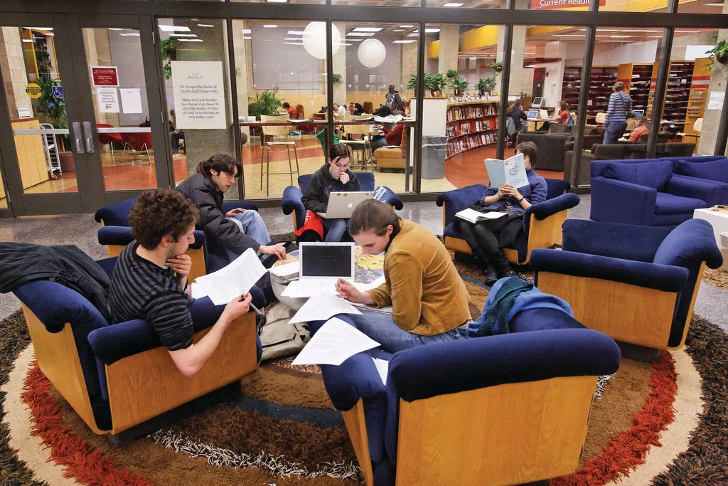 A group of students work in cushy chairs in Terrell Library