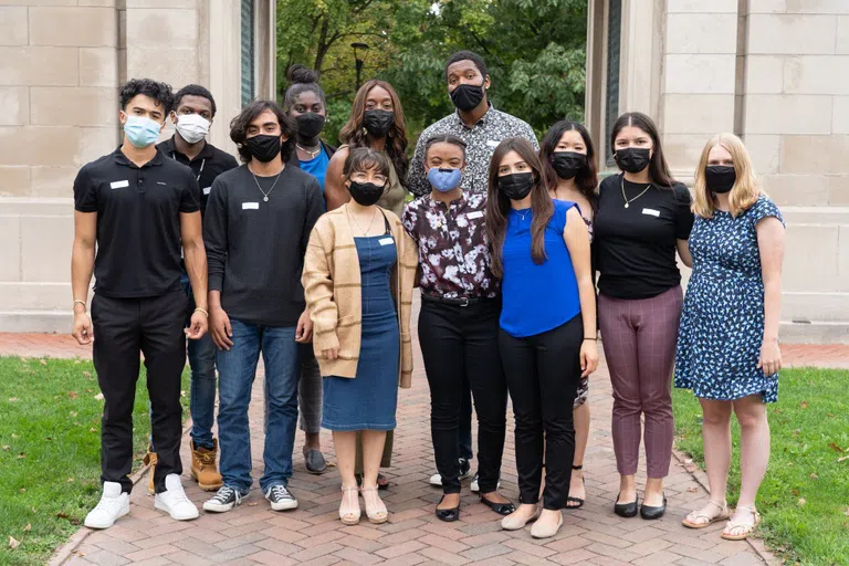 Oberlin's Posse Scholars stand outside smiling and facing the camera