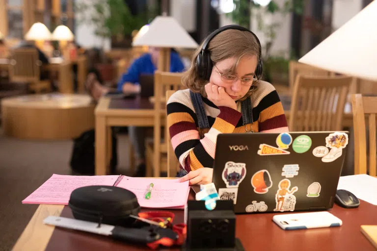 A student studies in the science library.