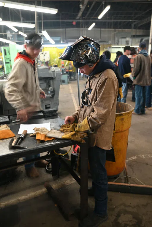 Student in welding mask in Industrial Technology Building