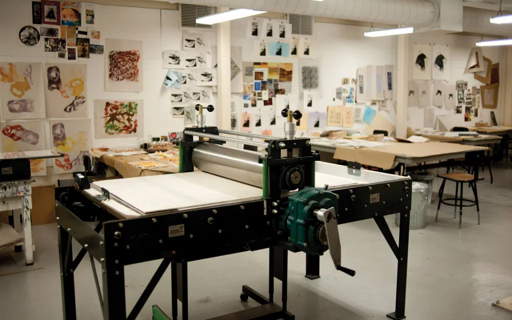 An art studio with a large press.