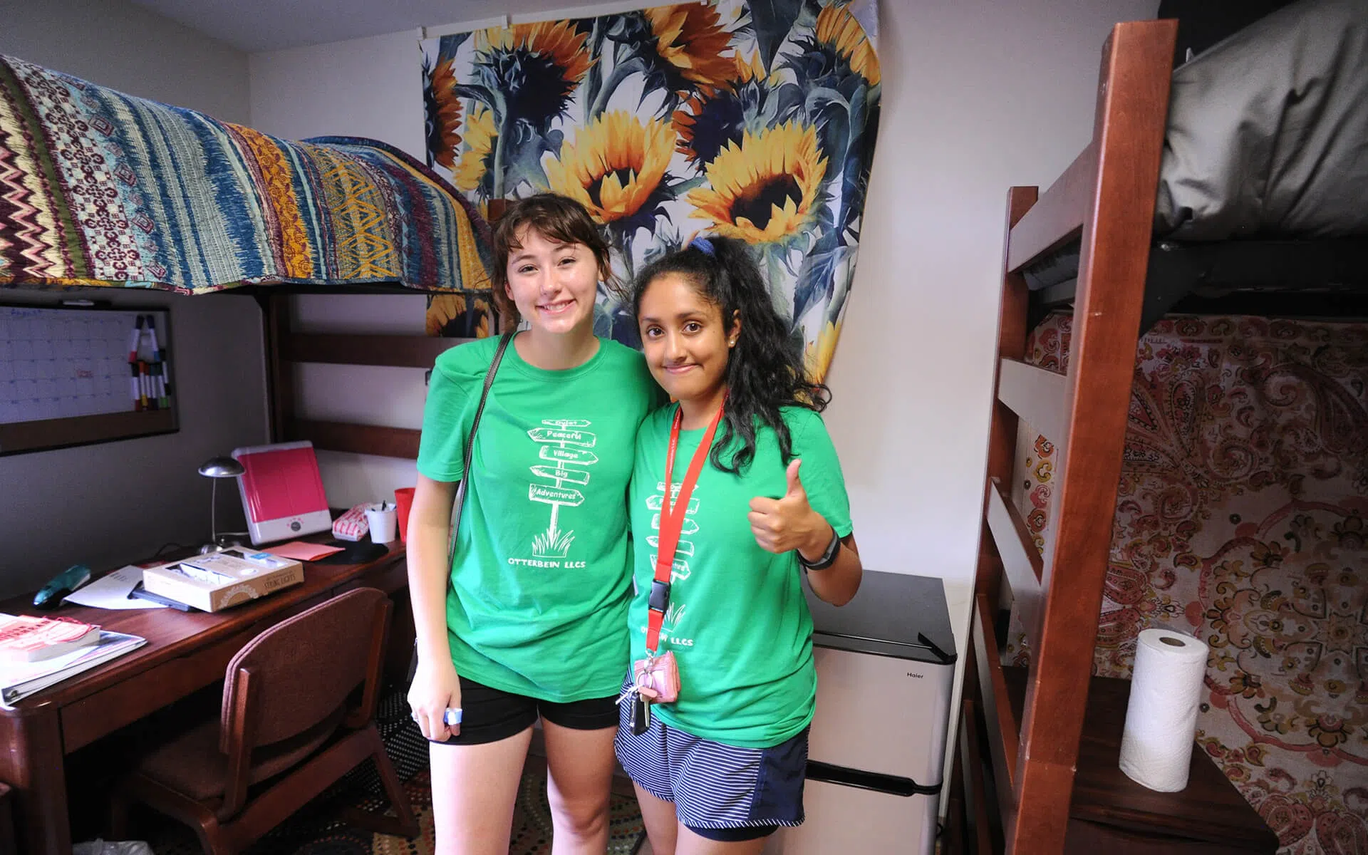 Two Otterbein Residencet Assitants in a dorm room.