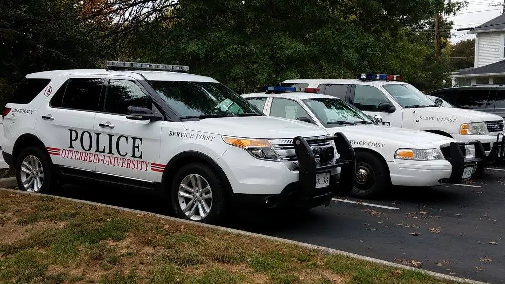 Three police vehicles are lined up: An SUV, a car, and another SUV. They are white with the word POLICE on the side.