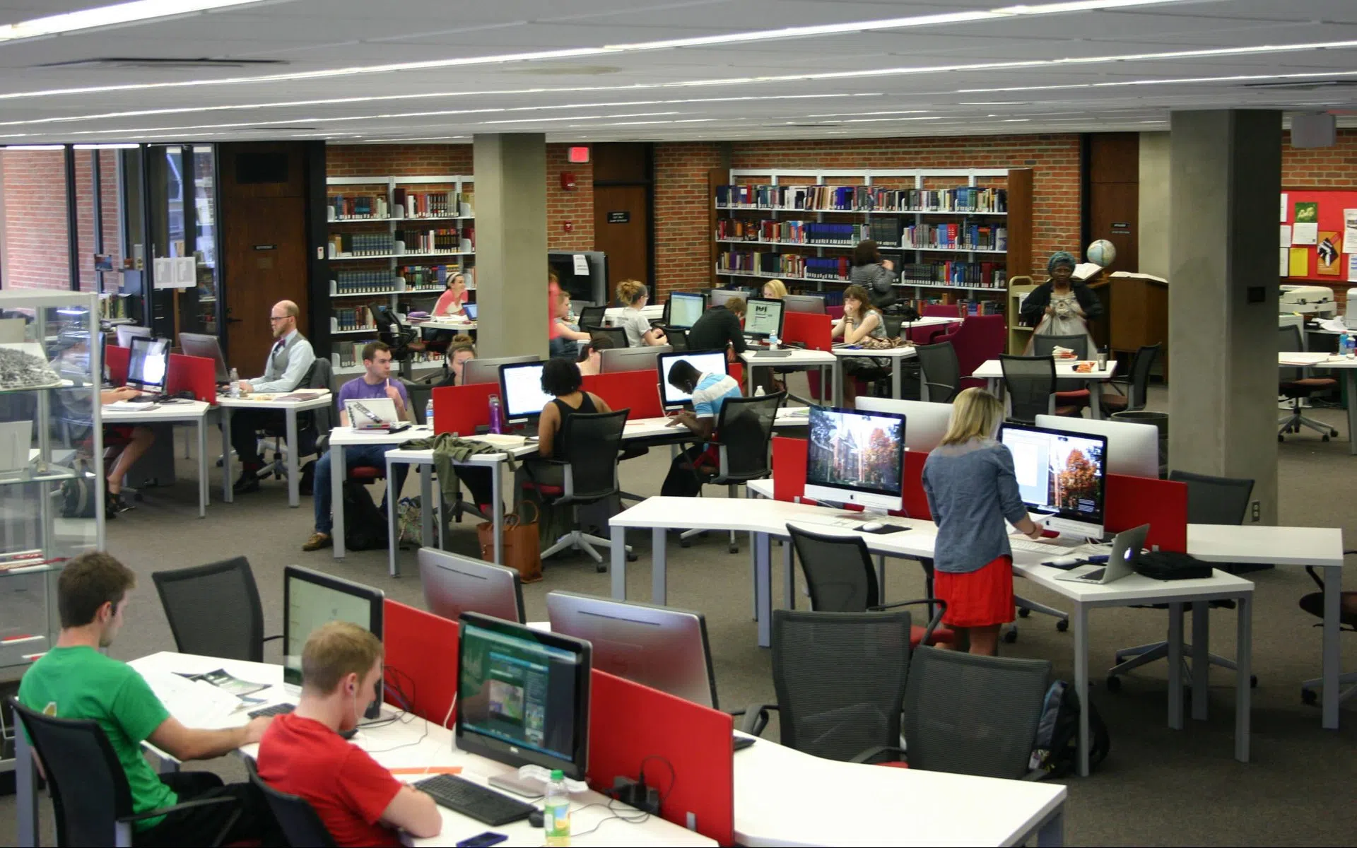 Tables with computers and students working