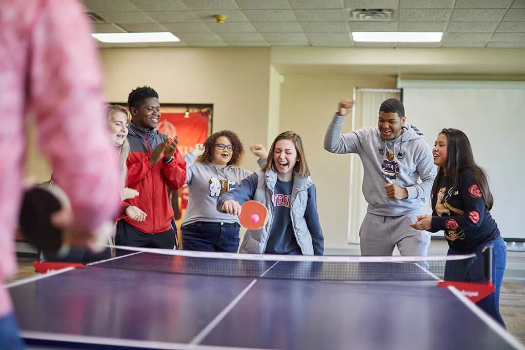 Students playing ping pong