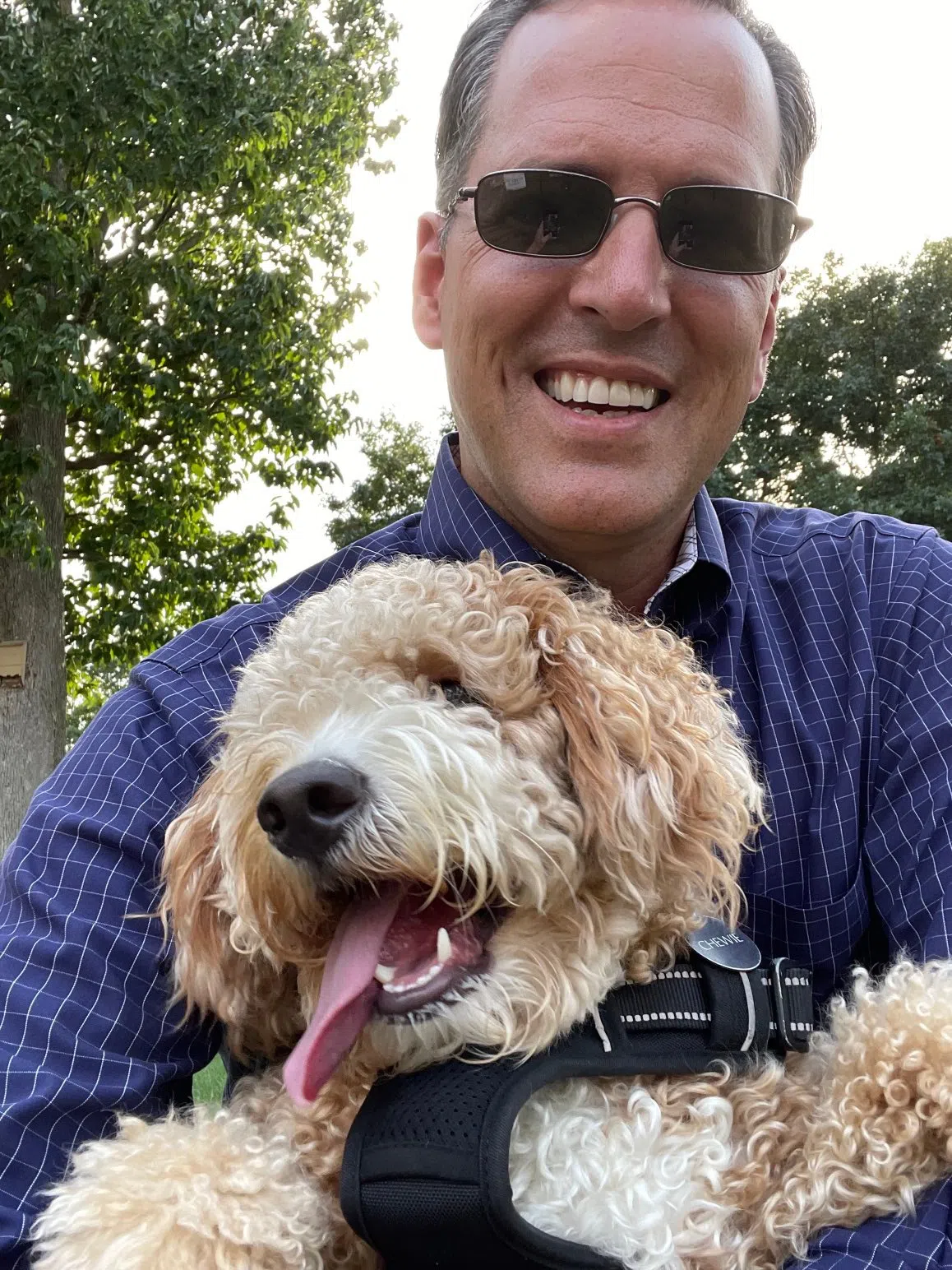 President Comerford poses for a selfie with his dog, Chewie.