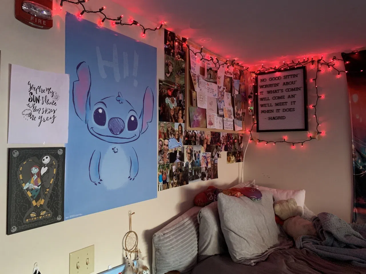 Colorful dorm room decorated with lights, posters, etc.